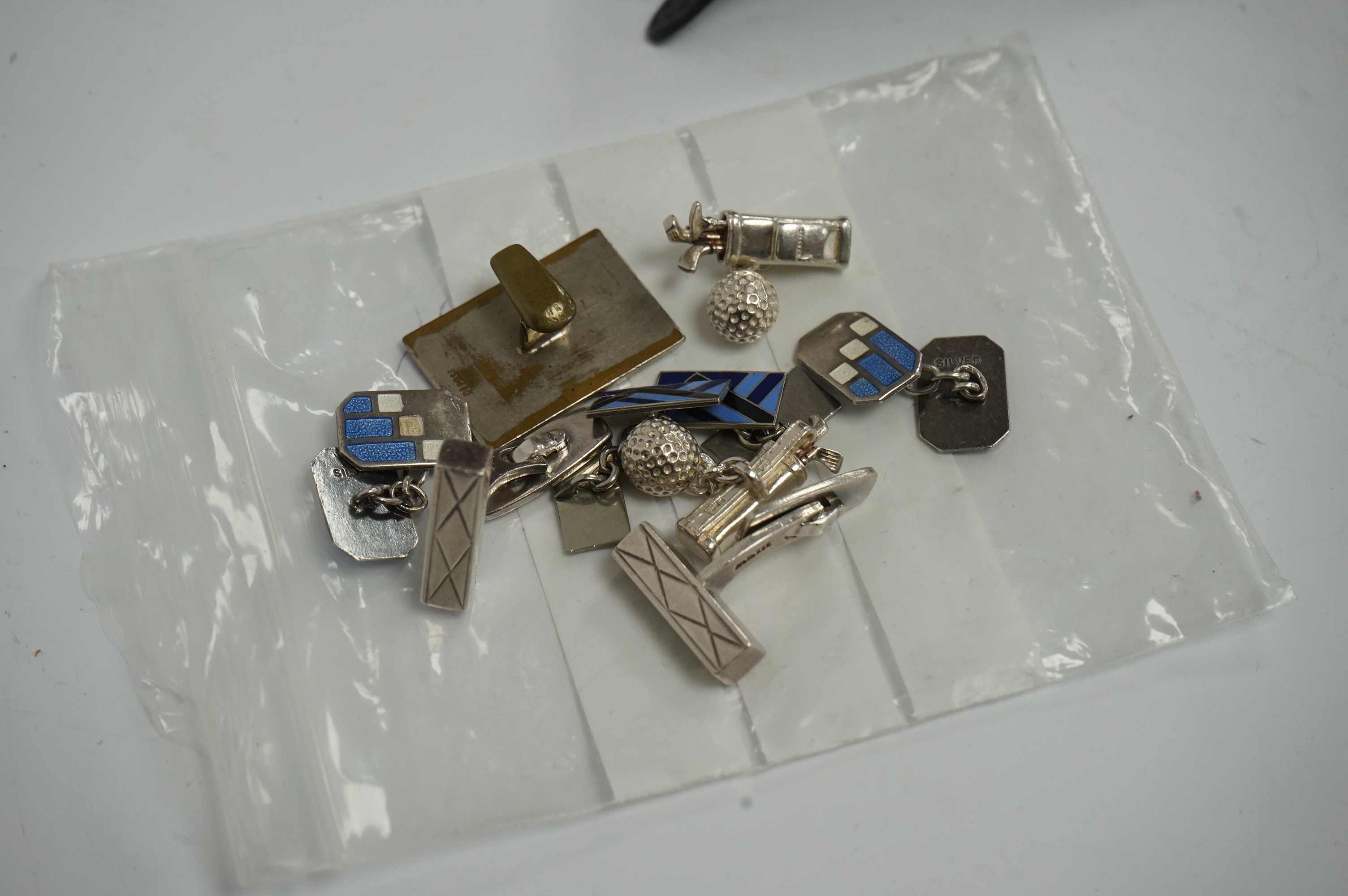 A rare Bank of England '£20 note' enamel badge, 29mm, three pairs of silver cufflinks and a quantity of assorted costume jewellery Condition - poor to fair